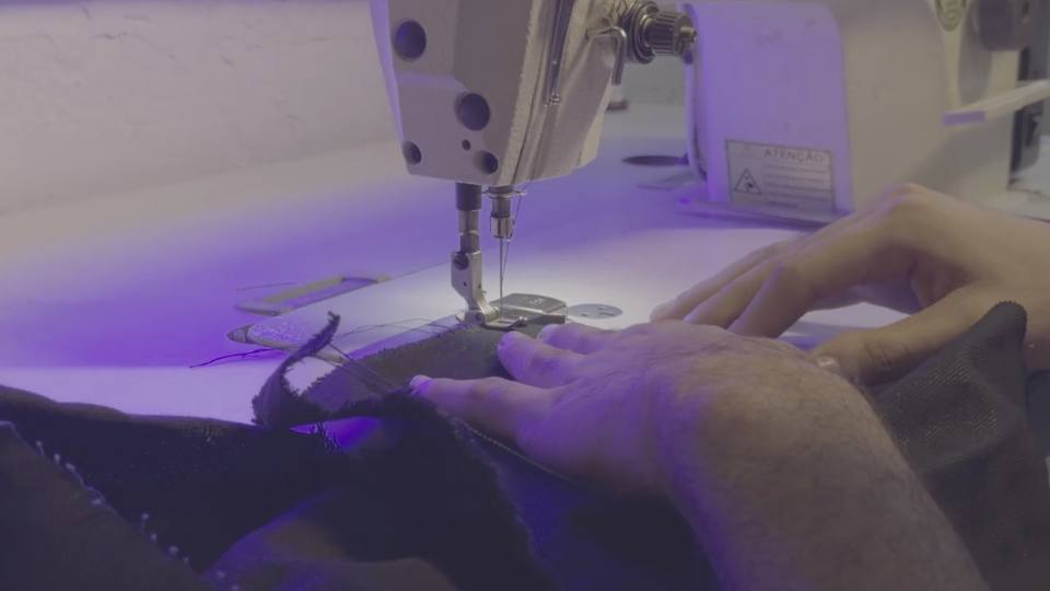 Industrial sewing machine stitching fabric